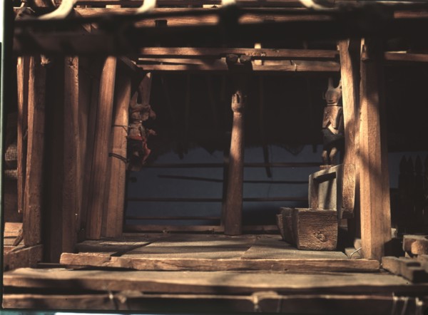 Model of a Nias spirit or ghost house, which ancestral spirits, represented by the carved figures, were expected to inhabit