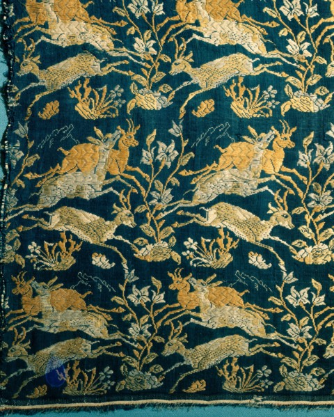 A compound silk cloth with a design of running deer and flowers