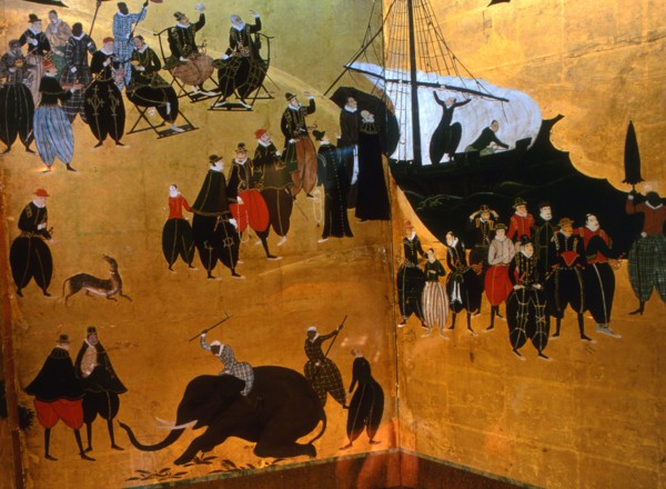 Detail from a folding namban jin or southern barbarian screen depicting a harbour scene recording the arrival of exotic looking Portuguese merchants in Japan