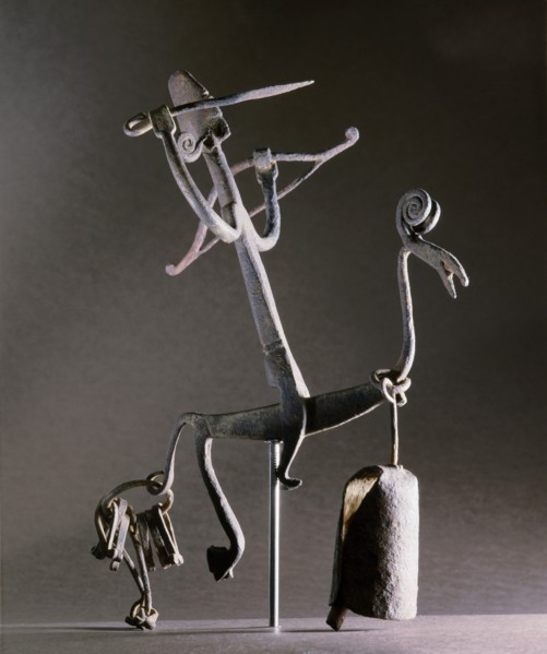 An altar iron in the form of a stylized horse and rider carrying a bow and arrow