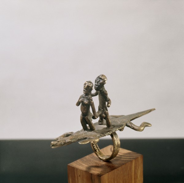 A finger ring in the form of a man with erect phallus and a woman on the back of a crocodile