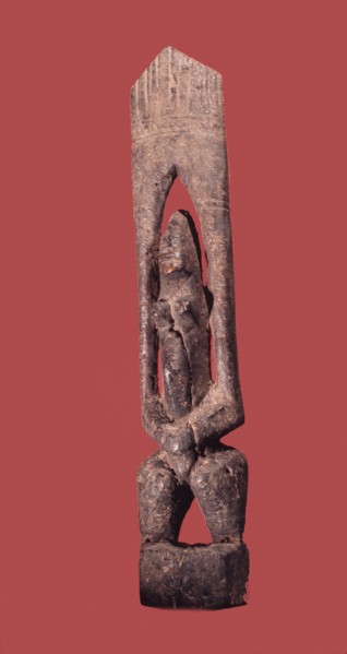 A wood sculpture of a nommo figure, the offspring of the Dogon creator god, Amma and his Earth wife