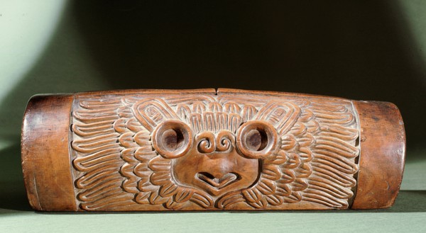 A teponaztli or two toned drum with a horned owl carved on the side