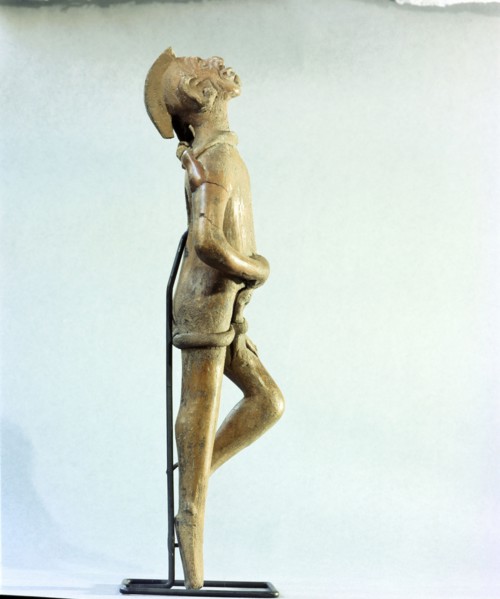 Figurine of a man singing and dancing at a festival