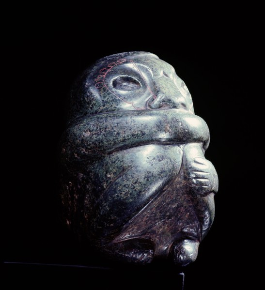 Figure in the form of a seated man