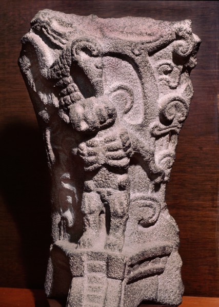 Hacha decorated in relief with a skeleton