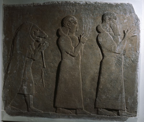 Assyrian officials with a mummer