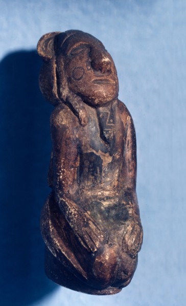 Tiny figurine carved from the fossil ivory of an Ice Age mammoth