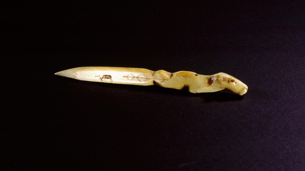 Small ivory knife with the handle carved in the form of an animal head, a caribou incised on the blade