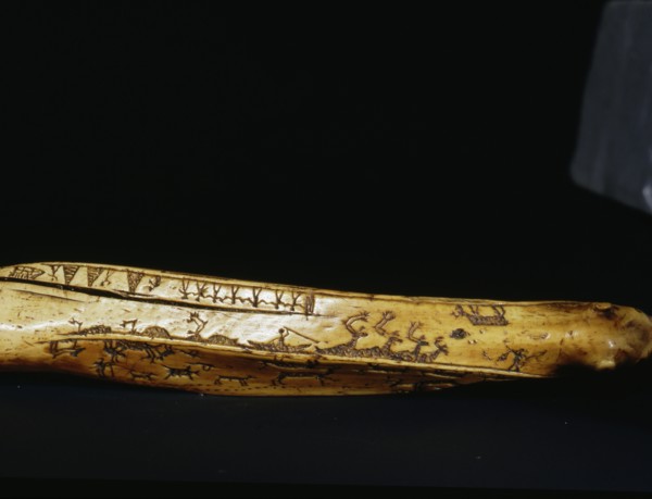 Incised bow drill handle illust rating a number of scenes