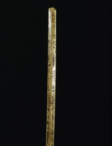 Broken ivory bow drill handle with incised sketches of hunting and travel scenes