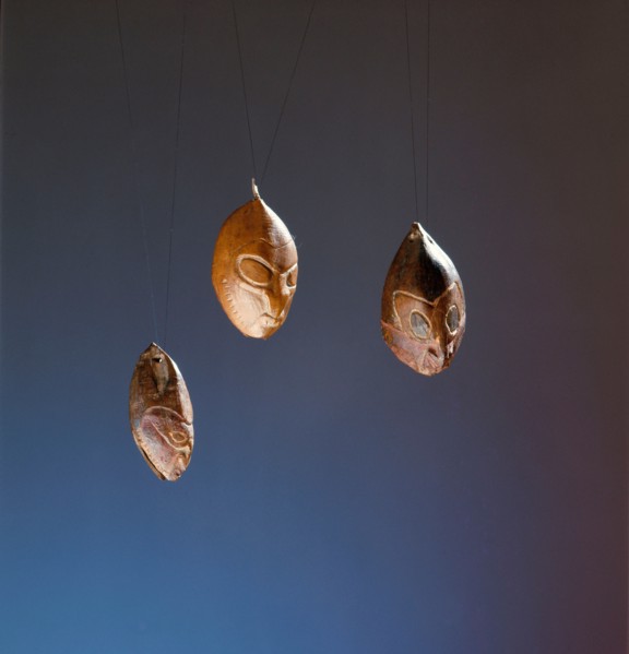 Nuts or seeds carved with ancestral faces
