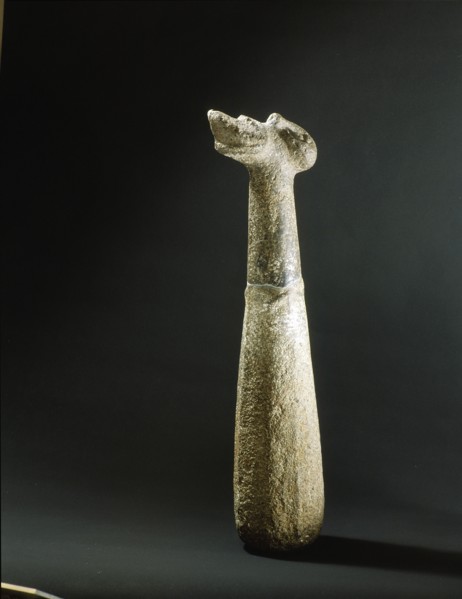 Stone pounder, with human head on the butt and chevrons at the mid point representing arms