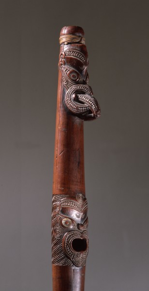 Putorino, or flute trumpet carved with three aggressive faces