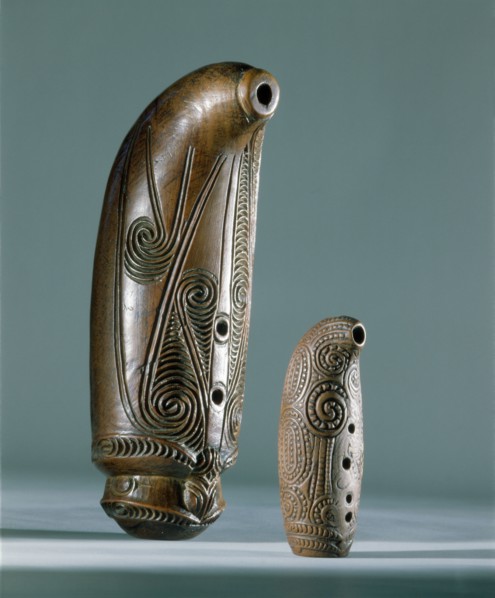 Nguru, open tube flutes, with three finger holes are blown across the wide end