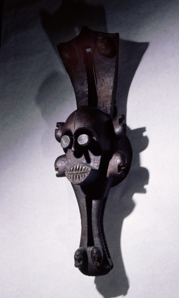 Mask representing a water spirit, worn horizontally on top of head, surrounded by fibre costume Used in plays depicting the exploits and social life of the water spirits, which mirrors that of the vil...