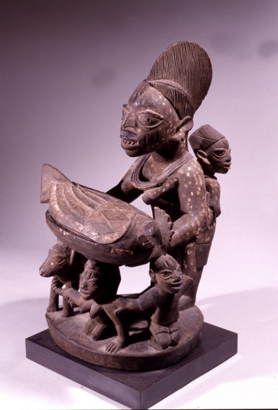 An offering bowl in the form of a mother and child with supporting figures