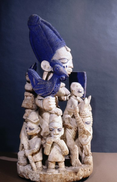 A shrine figure displaying the attributes of wealth (the horse), fertility (the nubile woman and her child), and power expressed by numerous followers