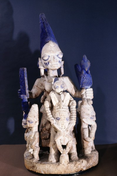 A shrine figure displaying the attributes of wealth (the horse), fertility (the nubile woman and her child), and power expressed by numerous followers