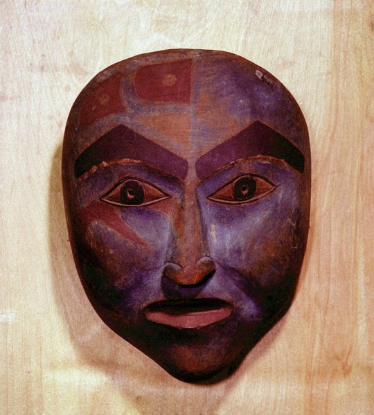 Wooden mask in the form of a human face