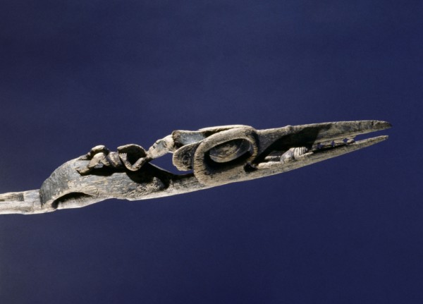 Wand carved to represent a crane with the witch spirit on the beak
