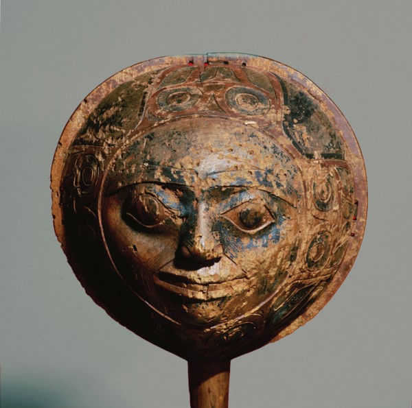 Shamans rattle in the form of a face with a border carved in low relief