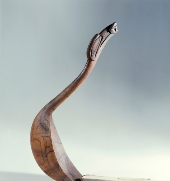 Spoon carved with a bird with a frog in its beak