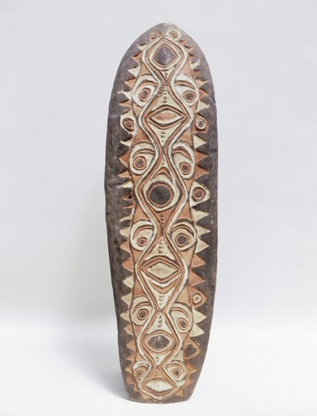 Shield with stylised low relief design