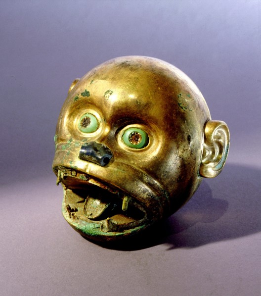 Gold monkey head bead which is typical of the elaborate funerary goods buried with Mochica nobility