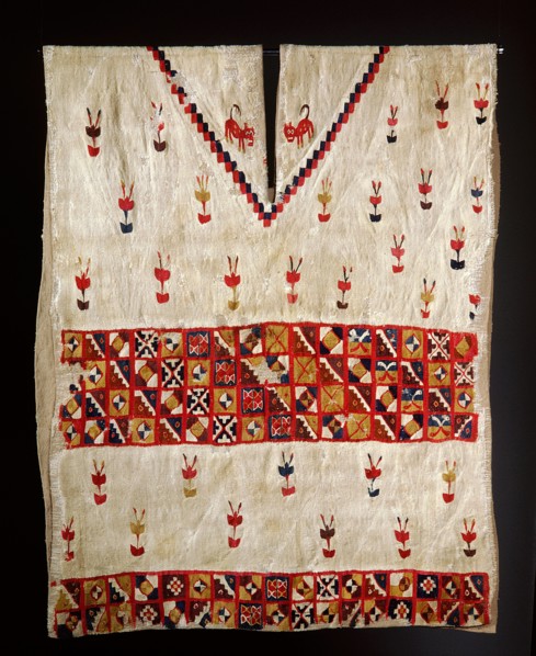 This Inca poncho, with interlocking designs, depicts plants and felines