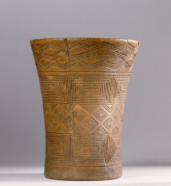 This Andean kero or ritual drinking vessel is decorated with Inca geometric designs