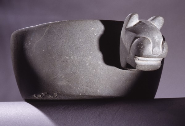 Carved stone bowl with feline head decoration