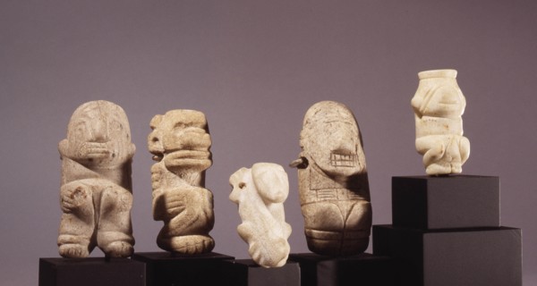 Miniature amulets of crouching dogs