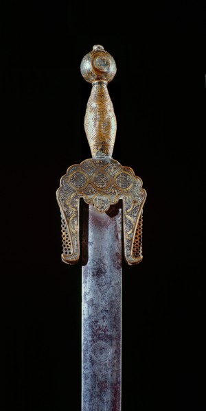 A very rare ceremonial iron sword with brass pommel