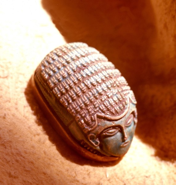 Green glazed steatite scarab with human face, found at the Nubian town of Kerma