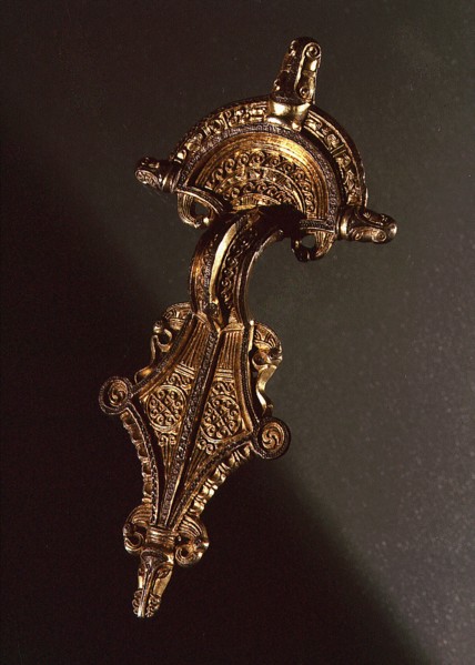 Brooch richly decorated with animals, human beings and gilt details