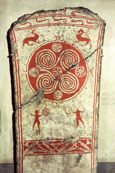 Memorial picture stone decorated with whorls symbolising the sunand vignettes from the hunt