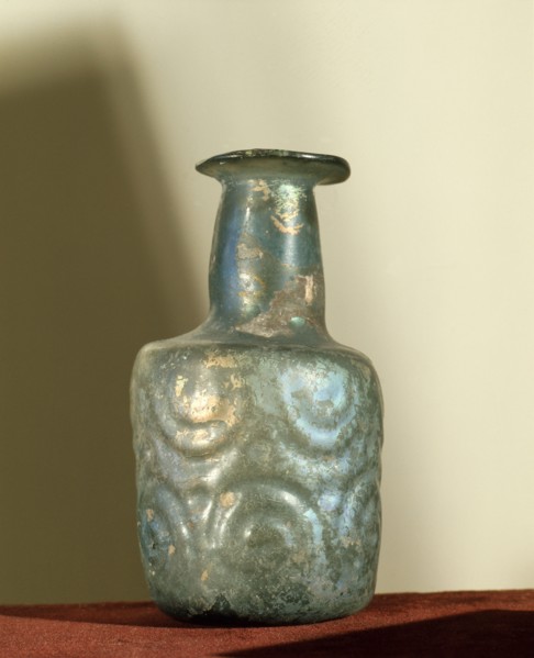 A bottle of irridescent glass
