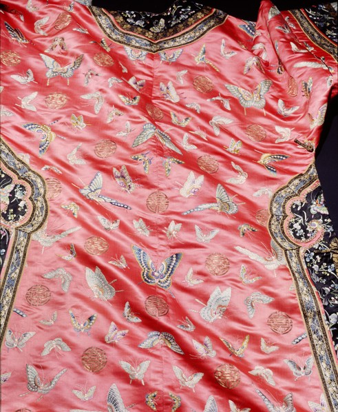 Detail of a dress embroidered with butterfly motifs
