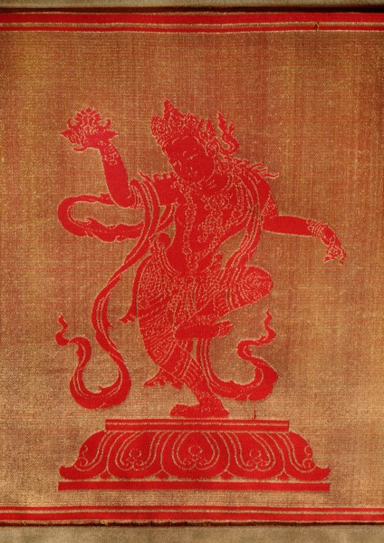 Sino Tibetan silk and gold brocade altar cloth depicting eight auspicious emblems interspersed by puja devis (offering goddesses) who offer gifts to the five Dhyani Buddhas, or Buddhas of meditation
