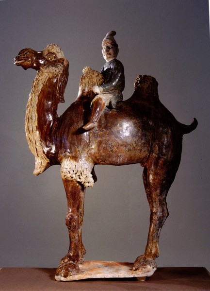 Sancai glazed tomb figure of a camel and foreign rider with an exaggeratedly large nose