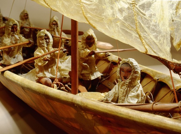 Model umiak with a helmsman and members of his family manning the oars