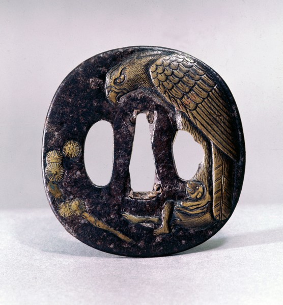Tsuba (sword guard) engraved with an eagle grasping a monkey in its talons