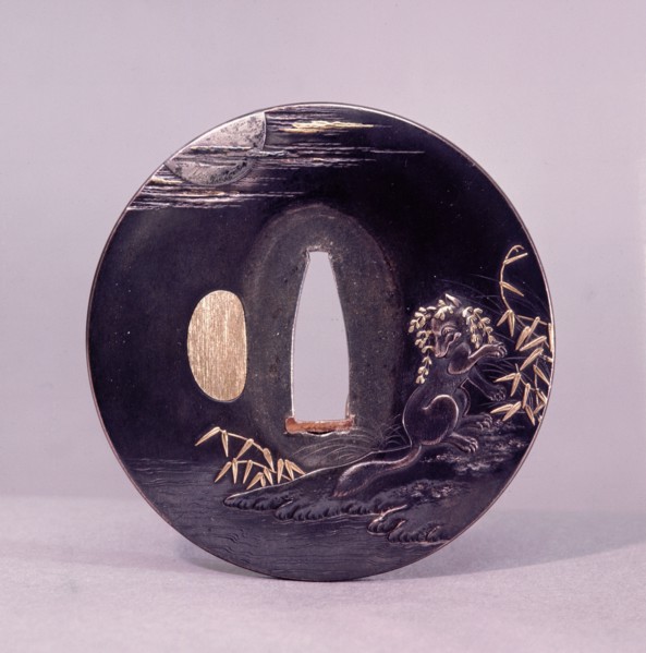 Tsuba (sword guard) decorated with a magic fox disguising itself as a woman