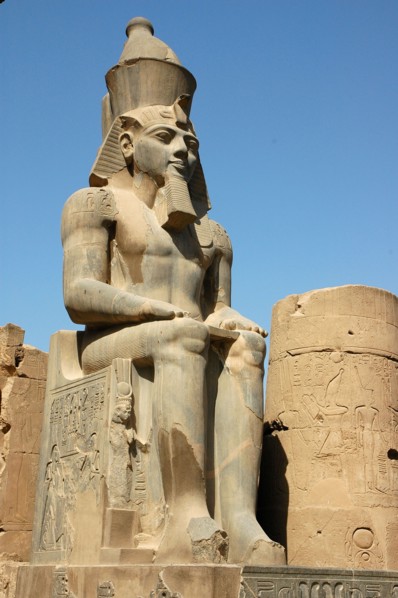 Seated figure of Rameses II wearing the double crown of Upper and Lower Egypt