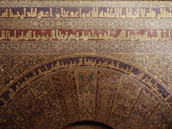 Detail of calligraphy and decorative mosaics above the door of the Iman in the Great Mosque of Cordoba