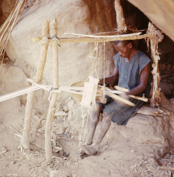 Dogon weaver, using a local variant of the narrow-strip double-heddle loom common throughout West Africa
