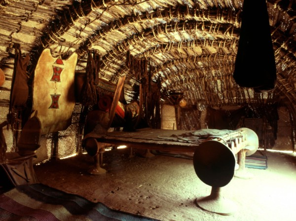 An interior of a tent 'house' with a large bed