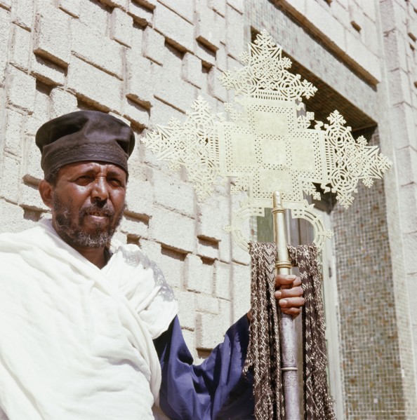 Monk with processional cross at the Cathedral of Our Lady of Sion, Axum