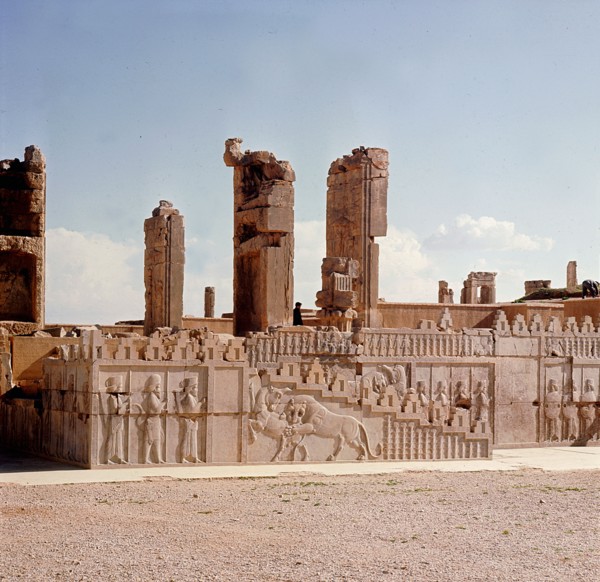A detail of a relief carving on the staircase leading to the Tripylon at Persepolis, depicting a lion attacking a bull